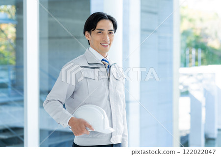A businessman wearing work clothes A businessman wearing work clothes 122022047