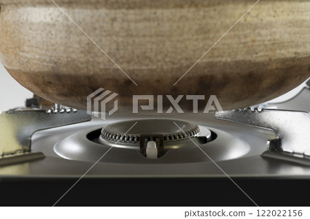 Lighting a portable tabletop stove 122022156