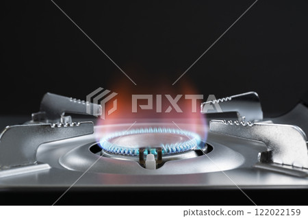 Lighting a portable tabletop stove 122022159