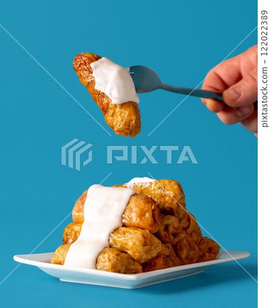 Romanian dish, cabbage rolls topped with sour cream sauce. Romanian dish, cabbage rolls topped with sour cream sauce. 122022389