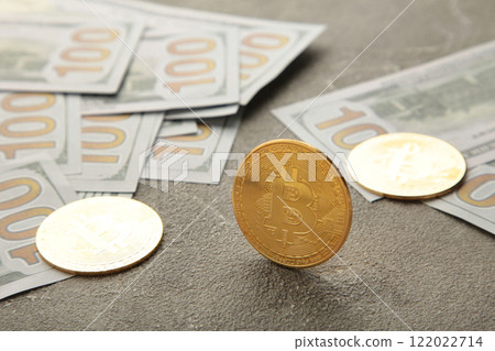 Bitcoin coin and cash on grey background. Bitcoin growthand investment concept. Bitcoin coin and cash on grey background. Bitcoin growthand investment concept. 122022714