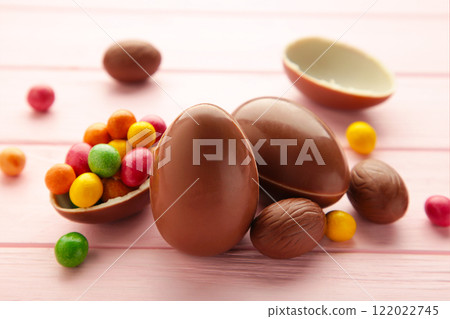 Chocolate easter eggs on wooden pink background. Chocolate easter eggs on wooden pink background. 122022745
