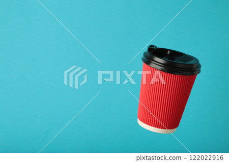 Flying mock up coffee or tea paper cup with cap on blue background. Logo Template Flying mock up coffee or tea paper cup with cap on blue background. Logo Template 122022916