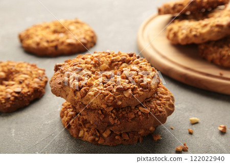 Peanut cookies on cutting board on grey background. Bakery products. 122022940