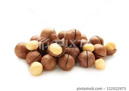 Peeled macadamia nuts. Horizontal composition isolated on white background. Peeled macadamia nuts. Horizontal composition isolated on white background. 122022973