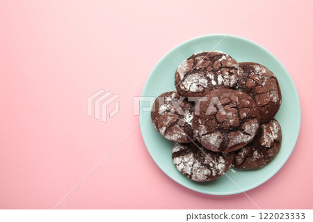 Dark Chocolate chip cookies on plate on pink background. Delicious Cookie Macro 122023333