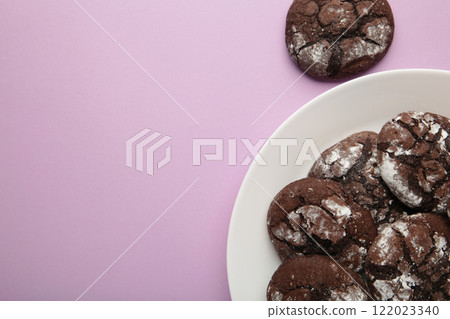 Dark Chocolate chip cookies on plate on purple background. Delicious Cookie Macro 122023340