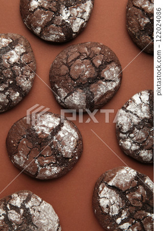 Soft dark chocolate brownie cookies on brown background. Vertical photo 122024086