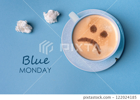 Blue Monday. Unhappy coffee with sad face 122024185