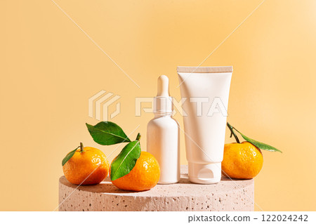 White face serum and cream and orange fruit White face serum and cream and orange fruit 122024242