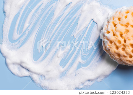Sponge with foam texture on blue Sponge with foam texture on blue 122024253