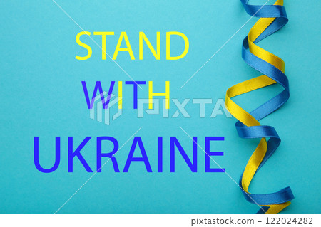 Inscription Stand with Ukraine on blue background. Conflict between Ukraine and Russia. No war, stop war, russian aggression. Ukrainian patriot. 122024282