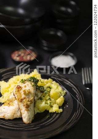 Typical czech cuisine zander fillet on garlic with mashed potatoes 122024734