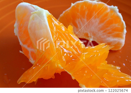 A close-up of a bunch of peeled mandarins A close-up of a bunch of peeled mandarins 122025674
