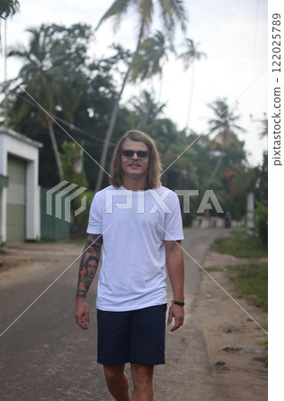 Embracing the carefree summer vibes in a stunning, beautiful tropical paradise by the beach 122025789