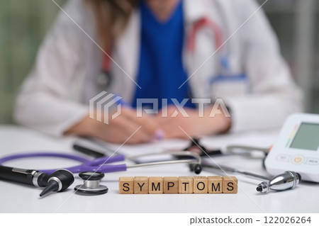 A Healthcare Professional Diligently Analyzing Various Symptoms with Advanced Medical Equipment 122026264