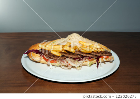 Beef steak and fries sandwich retro flash food photography. 122026273