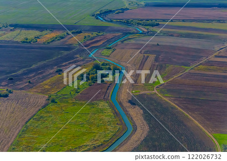 Aerial view of valley with farm fields, pond and Danube river. High quality photo 122026732