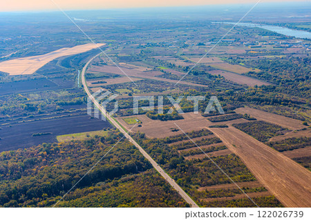 Aerial view of valley with farm fields, pond and Danube river. High quality photo 122026739