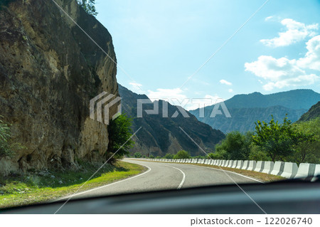 A road with a mountain in the background 122026740