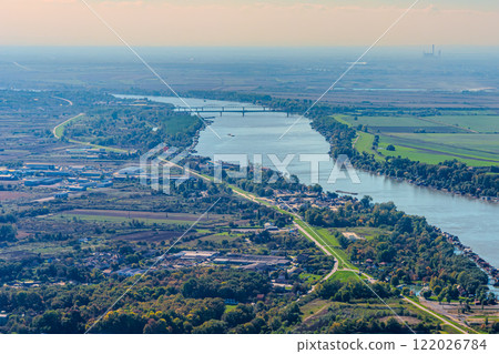 Aerial view of valley with farm fields, pond and Danube river. High quality photo 122026784