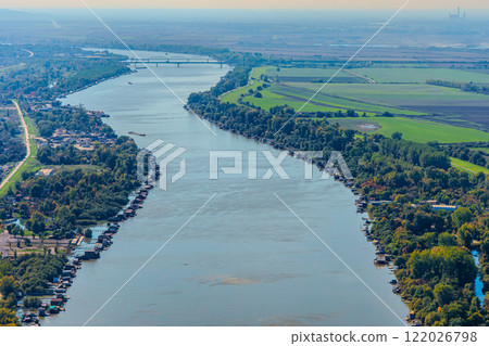 Aerial view of valley with farm fields, pond and Danube river. High quality photo 122026798