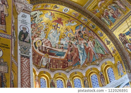 Belgrade, Serbia- 10162024: The Temple Of Saint Sava indoor interior, people pray in an Orthodox church, frescoes on the ceilings and walls of the church. High quality photo 122026891