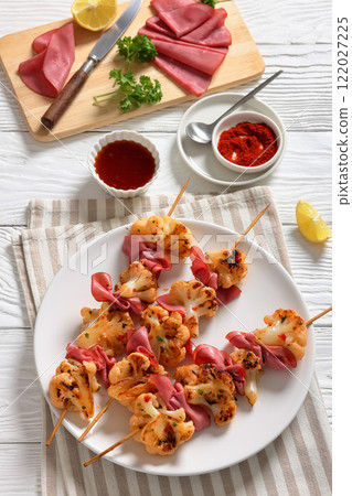 spicy cauliflower kebabs with corned beef on plate spicy cauliflower kebabs with corned beef on plate 122027225