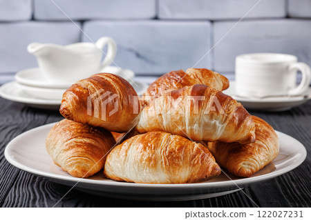 freshly baked in oven croissants on a plate freshly baked in oven croissants on a plate 122027231