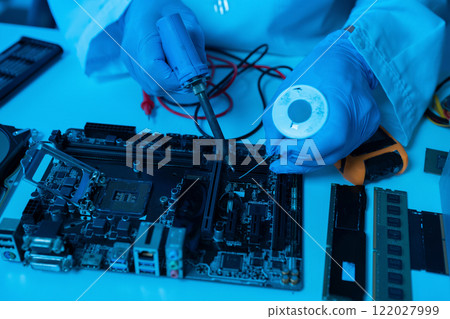 Close up of Technician measuring voltage electronic circuit board, Service after sale fix electric equipment. Close up of Technician measuring voltage electronic circuit board, Service after sale fix electric equipment. 122027999