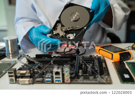 Close up of Technician measuring voltage electronic circuit board, Service after sale fix electric equipment. Close up of Technician measuring voltage electronic circuit board, Service after sale fix electric equipment. 122028003