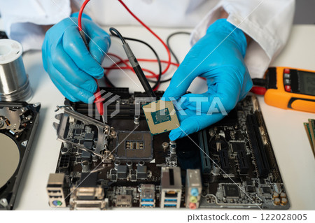 Close up of Technician measuring voltage electronic circuit board, Service after sale fix electric equipment. 122028005