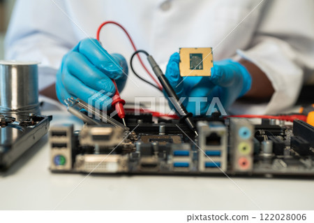 Close up of Technician measuring voltage electronic circuit board, Service after sale fix electric equipment. Close up of Technician measuring voltage electronic circuit board, Service after sale fix electric equipment. 122028006