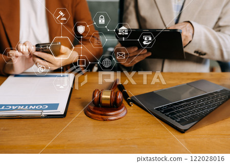 Teamwork of business lawyer meeting working hard about legal legislation in courtroom to help their customer Teamwork of business lawyer meeting working hard about legal legislation in courtroom to help their customer 122028016