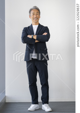 A man in his 60s smiling at the camera 122028637