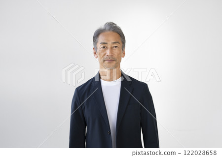 A man in his 60s looking at the camera 122028658