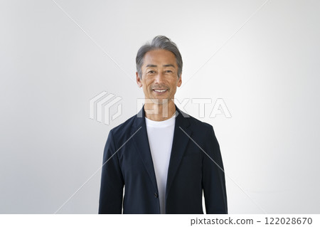 A man in his 60s smiling at the camera 122028670