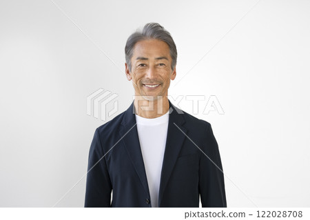 A man in his 60s smiling at the camera A man in his 60s smiling at the camera 122028708