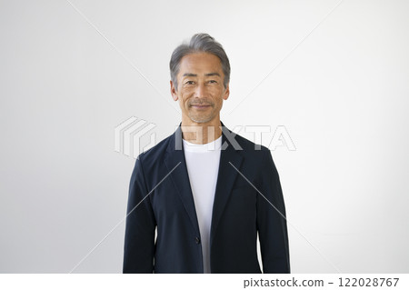 A man in his 60s smiling at the camera 122028767