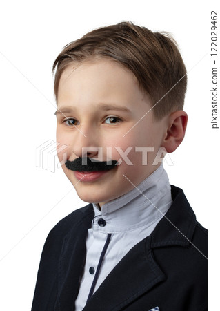A funny humorous portrait of a little boy with a false mustache. A theatrical child. A funny humorous portrait of a little boy with a false mustache. A theatrical child. 122029462