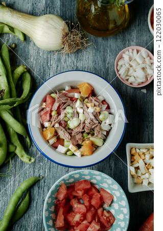 andalusian broad bean salad served on a white bowl andalusian broad bean salad served on a white bowl 122030065