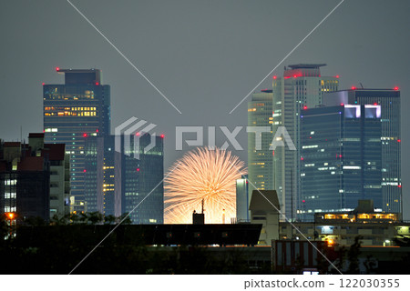 <Aichi Prefecture> Fireworks at Nagoya Port and the skyscrapers of Nagoya Station as seen from the Shonai River embankment 122030355