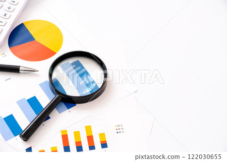 Free space for business documents and magnifying glass 122030655