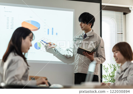 Engineer explaining statistics in a conference room 122030894