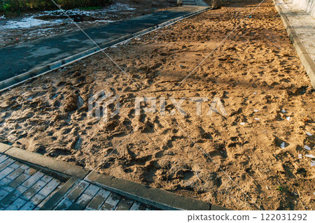 lack of lawn in the city. problem with landscape design in Kazakhstan. dirt and slush the sidewalks 122031292