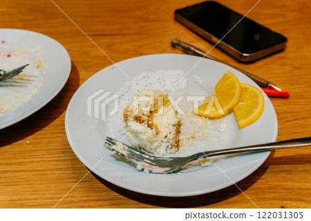 plates stained with cream after dessert. dirty plates in a coffee shop on the table 122031305