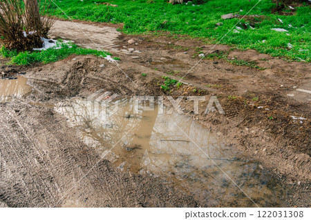 lack of lawn in the city. problem with landscape design in Kazakhstan. dirt and slush the sidewalks lack of lawn in the city. problem with landscape design in Kazakhstan. dirt and slush the sidewalks 122031308