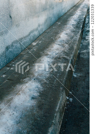 dangerous ice on the pedestrian crossing. the state's problem with cleaning pedestrian roads dangerous ice on the pedestrian crossing. the state's problem with cleaning pedestrian roads 122031339