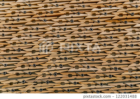 texture of wooden clothespins. wooden clips attached to each other texture of wooden clothespins. wooden clips attached to each other 122031488