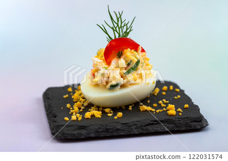 Stuffed egg with shrimp and herbs. Stuffed egg with shrimp and herbs. 122031574